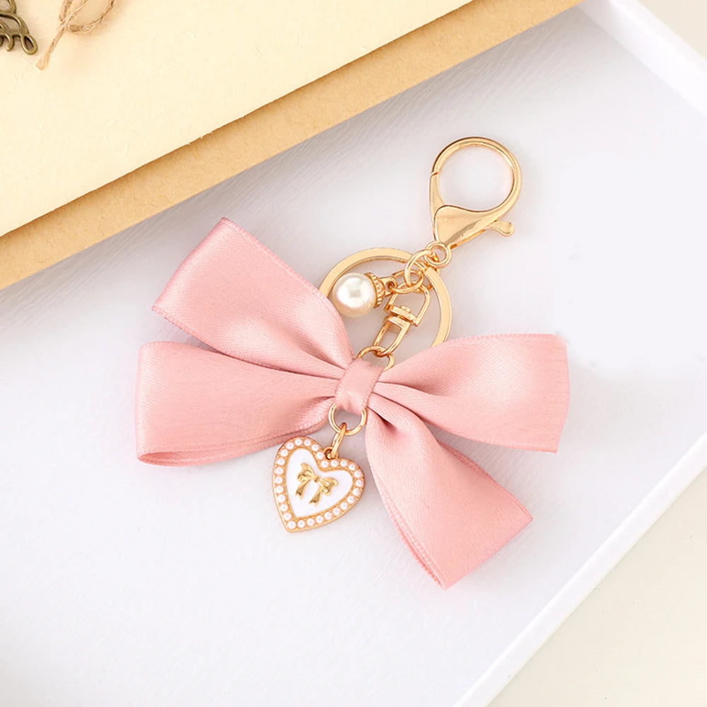 Kawaii Imitation Pearl Keychain πΈ Cute Ribbon Bowknot Bag Charm π Stylish Metal Buckle Accessory for Women π Perfect Gift Jewelry