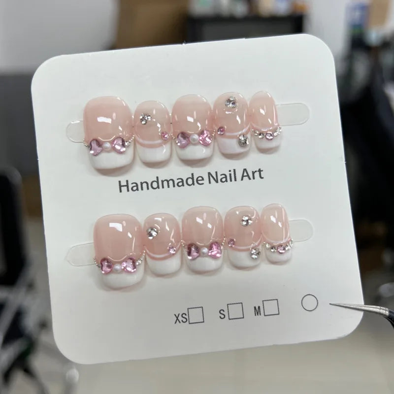 Kawaii 10Pcs Glittery Press-On Nails πΈβ¨ Short Oval Pink with 3D Bow & Diamond Design π Perfect for Cute Nail Art!