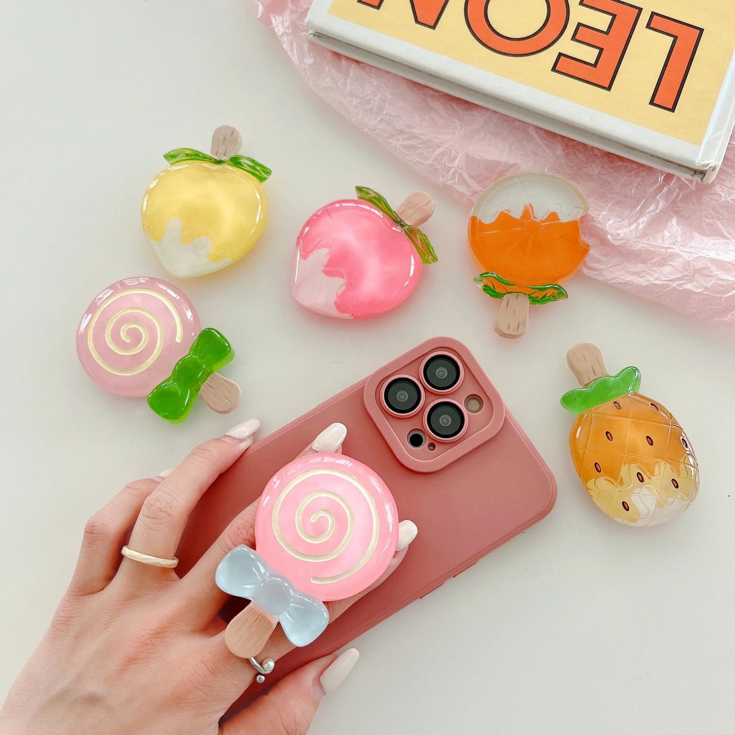 🍓 Adorable Strawberry Glass Lollipop Phone Grip & Stand 🌟 Universal Fit for All Phones 📱✨ - Pixie Quill