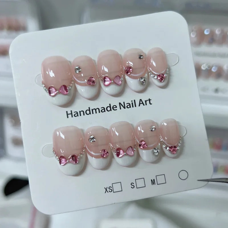 Kawaii 10Pcs Glittery Press-On Nails πΈβ¨ Short Oval Pink with 3D Bow & Diamond Design π Perfect for Cute Nail Art!