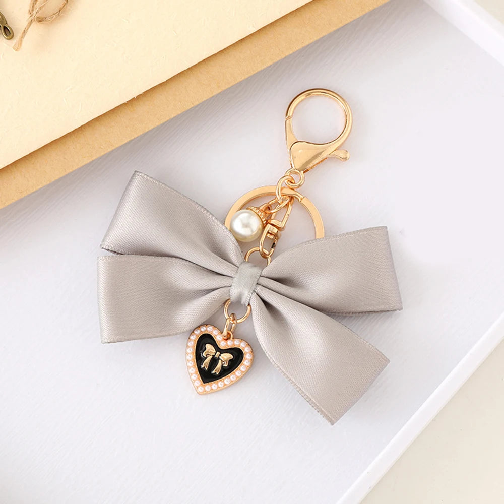 Kawaii Imitation Pearl Keychain πΈ Cute Ribbon Bowknot Bag Charm π Stylish Metal Buckle Accessory for Women π Perfect Gift Jewelry