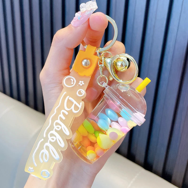 ✨ Adorable Quicksand Jelly Bean Keychain 🌈 - Whimsical Liquid Pearl Milk Tea Pendant for Trendy Bags & Keys! 🎀 - Pixie Quill