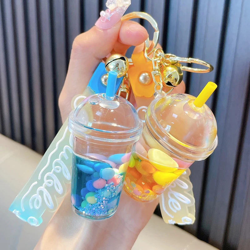 ✨ Adorable Quicksand Jelly Bean Keychain 🌈 - Whimsical Liquid Pearl Milk Tea Pendant for Trendy Bags & Keys! 🎀 - Pixie Quill