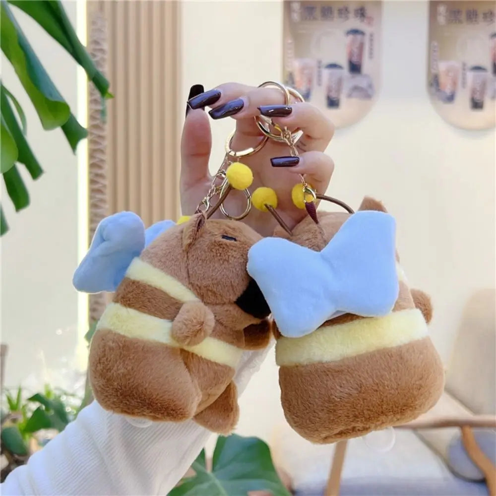 Kawaii Brown Capybara Keychain 🐹✨ Adorable Plush Doll with Funny Fluttering Wings - Perfect Bag Pendant! 🎉