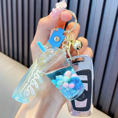 ✨ Adorable Quicksand Jelly Bean Keychain 🌈 - Whimsical Liquid Pearl Milk Tea Pendant for Trendy Bags & Keys! 🎀 - Pixie Quill