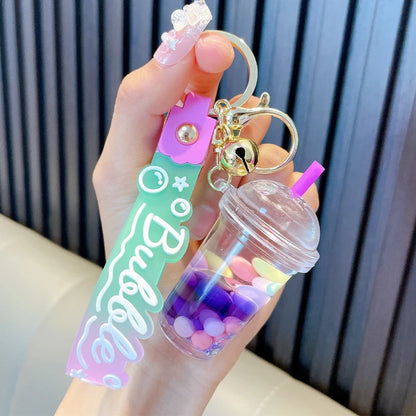 ✨ Adorable Quicksand Jelly Bean Keychain 🌈 - Whimsical Liquid Pearl Milk Tea Pendant for Trendy Bags & Keys! 🎀 - Pixie Quill