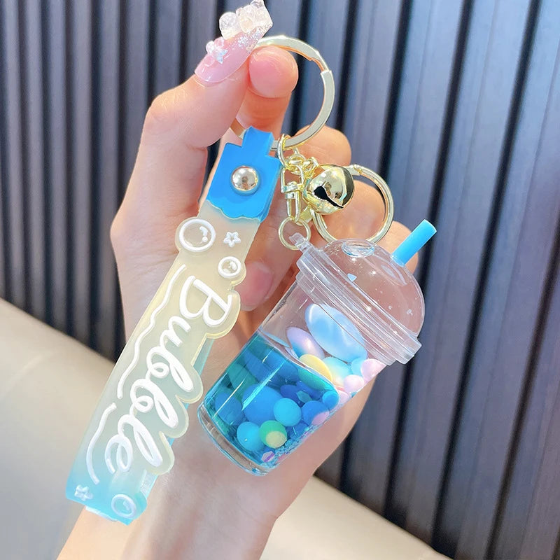 ✨ Adorable Quicksand Jelly Bean Keychain 🌈 - Whimsical Liquid Pearl Milk Tea Pendant for Trendy Bags & Keys! 🎀 - Pixie Quill