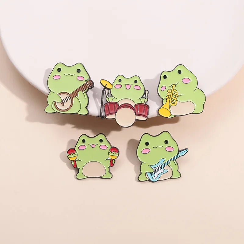 Kawaii Cartoon Frog Band Enamel Pins 🎶🐸 | Fun Drum & Guitar Brooches for Kids & Friends 🎸✨ | Cute Lapel Badges & Jewelry Gift